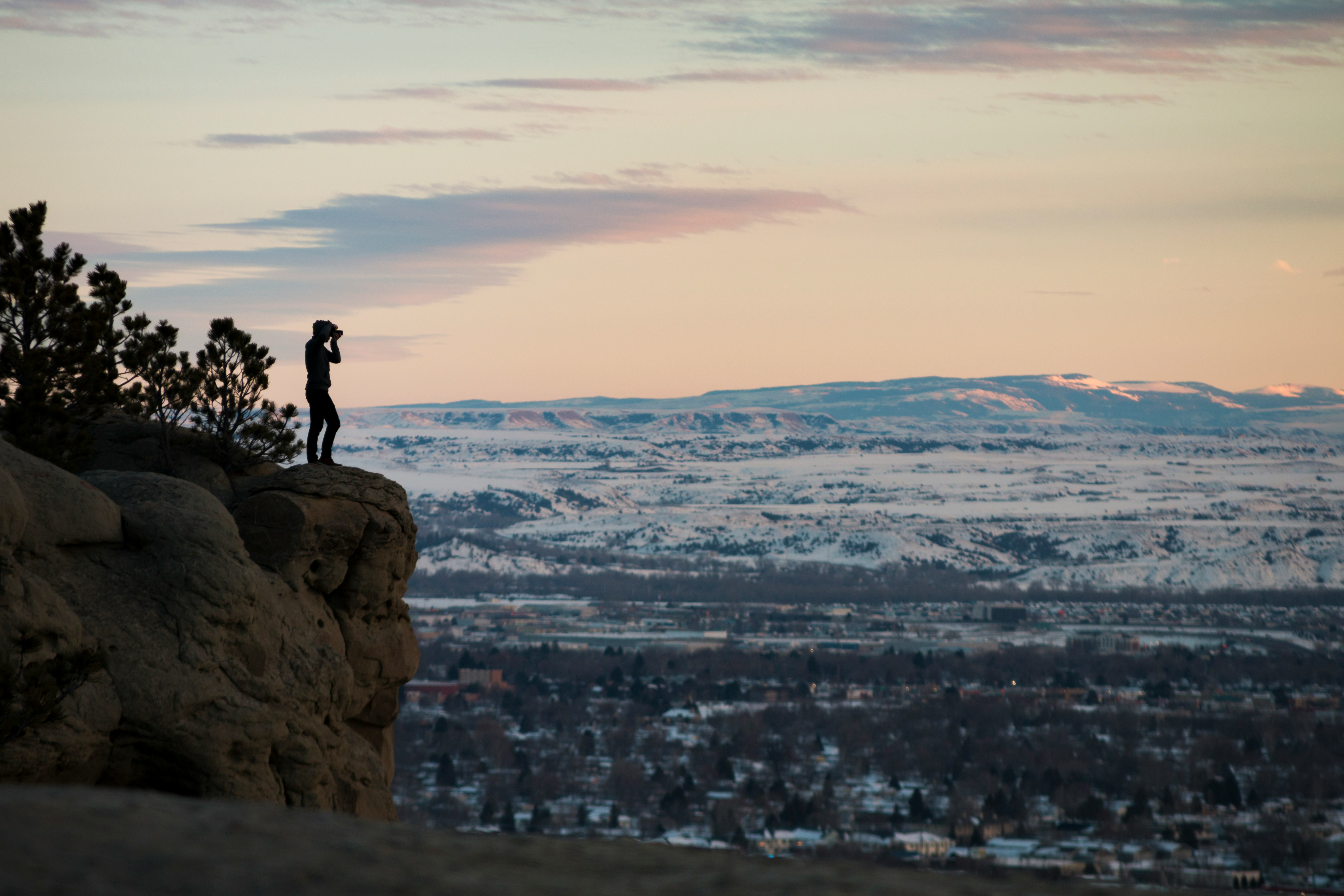 person standing on rock formation